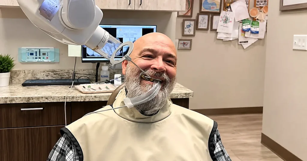A patient is being prepared for bridges and denture procedure by the dentist in Roanoke, TX