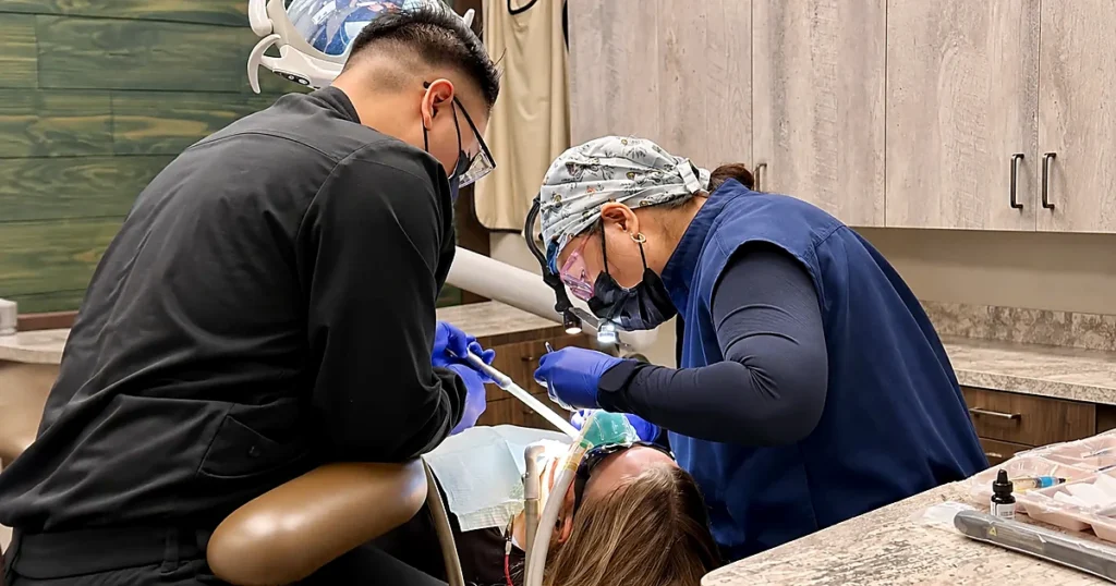 Dr. Rhea Antolin providing dental care to a patient at Garden Valley Dentistry